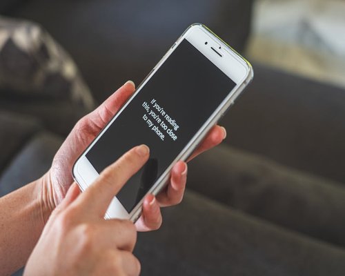 Close up of a smart phone held at an appropriate reading distance